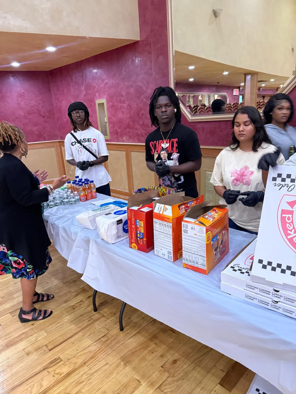 Young entrepreneurs displaying products at a community marketplace
