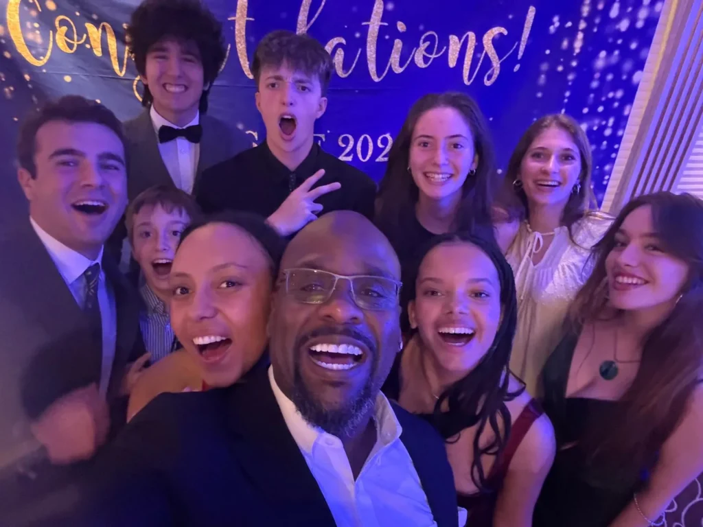 Event attendees taking a group selfie during a celebration